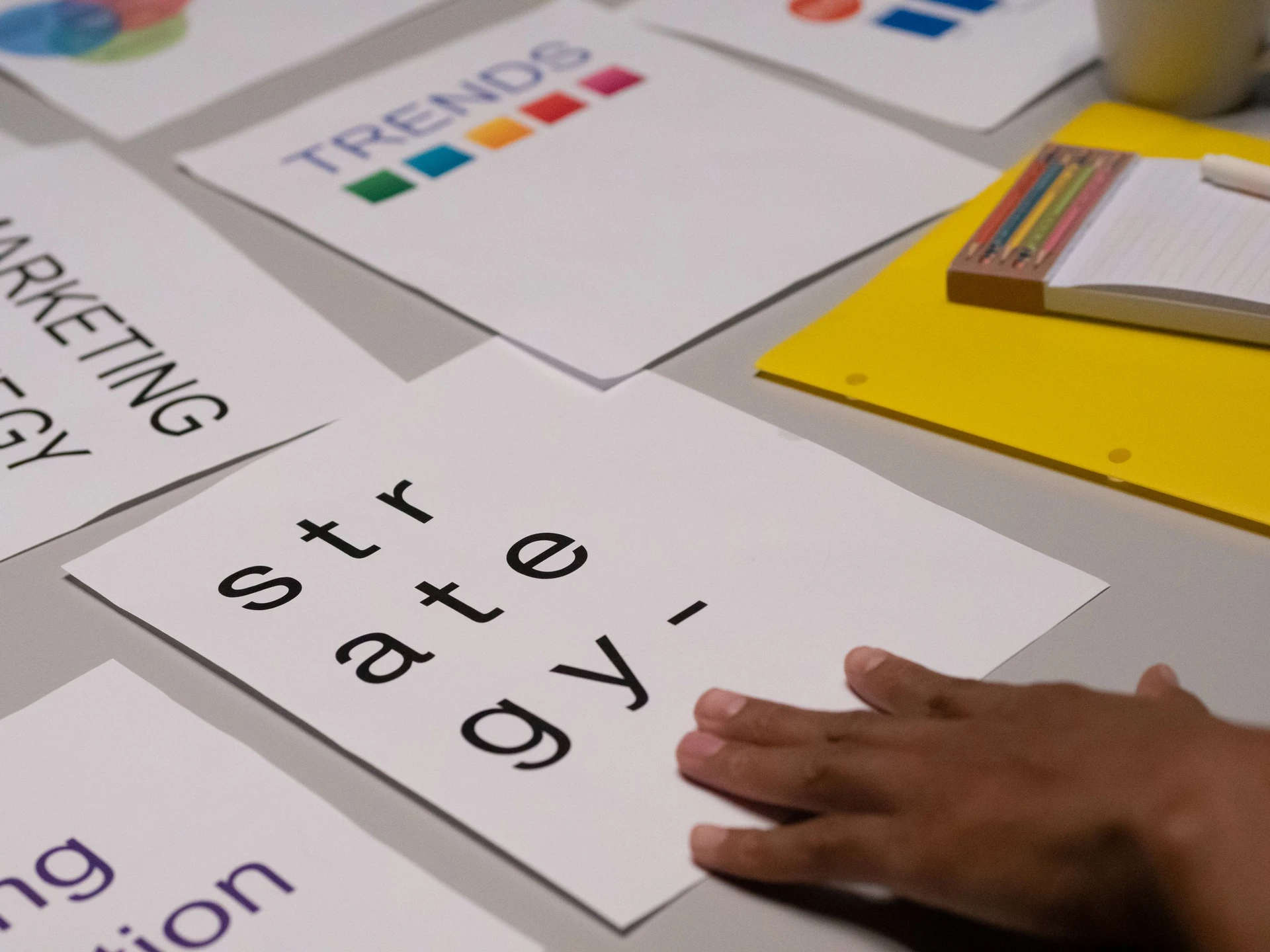 Printed marketing strategy materials being reviewed during a planning session